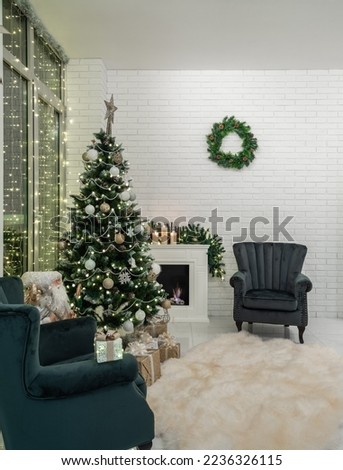 Christmas tree, gifts. Decorated fireplace. Wreath on wall. Interior.