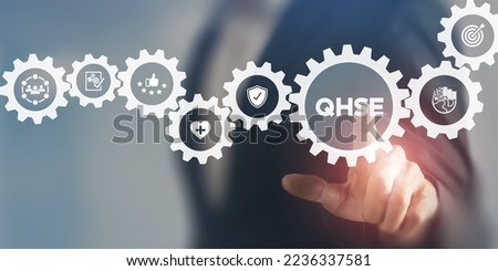 QHSE-Quality Health Safety Environment. Safety and health at workplace concept. Maximize value by successfully implementing QHSE management system. Businessman touching on QHSE and smart background. Royalty-Free Stock Photo #2236337581