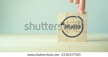 Rebranding strategy concept. Marketing and brand management. Rethinks marketing strategy with a new name, logo, or design, the intention of developing a new. Refreshing the look and feel of brand. Royalty-Free Stock Photo #2236337583