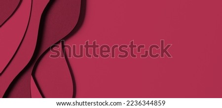 Abstract colored paper texture background. Minimal paper cut style composition with layers of geometric shapes and lines in viva magenta colors. Top view Royalty-Free Stock Photo #2236344859
