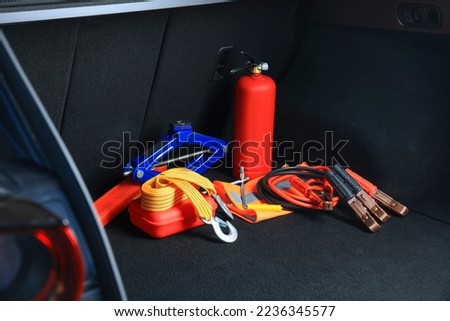 Set of car safety equipment in trunk Royalty-Free Stock Photo #2236345577