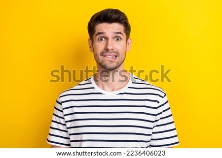 Photo of young funny grimace guy student oops mistake bite lips nervous forgot his house keys lost isolated on bright yellow color background Royalty-Free Stock Photo #2236406023