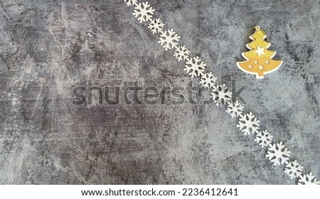 Christmas and New Year photo background on a gray base with Christmas trees, balloons, garland, tinsel, gold and green cones and paper texture packaging