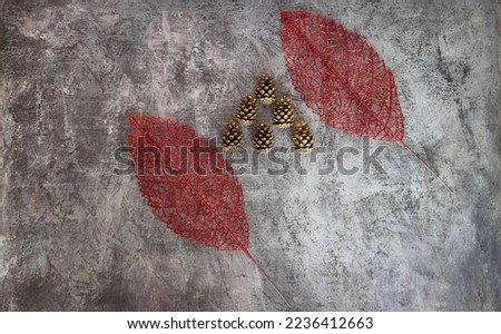Christmas and New Year photo background on a gray base with Christmas trees, balloons, garland, tinsel, gold and green cones and paper texture packaging