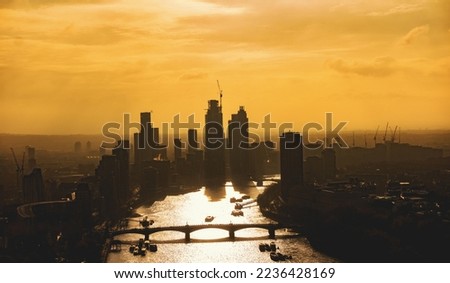 London Skyline with river and Bridge in the Eveningsun