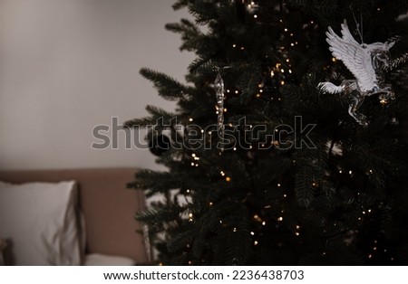 Beautiful decorated Christmas tree. selective focus. cute toys. lights. postcard