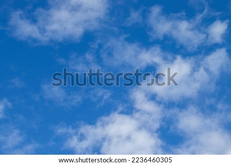 Clouds in the Sky. White, Fluffy Clouds in the Blue Sky. Background for Photo Wallpaper, for Your Desktop or Screensaver on your Phone.