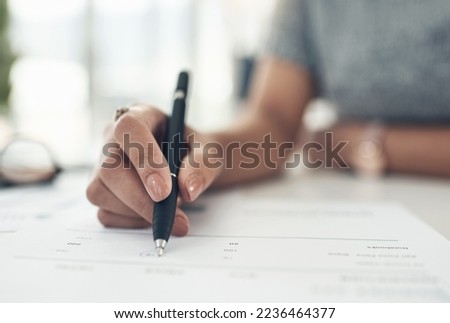 Writing, reading and making notes on finance, investment or tax contract and paperwork in an office. Hands closeup of a female financial worker planning, signing and working on banking forms
