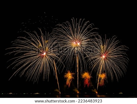 Firework display at night on isolated black background