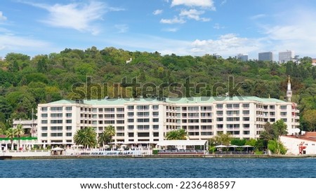 Exterior of modern architectural design five stars hotel building, suited by Bosphorus Strait, at Besiktas district, in a summer day, Istanbul, Turkey Royalty-Free Stock Photo #2236488597