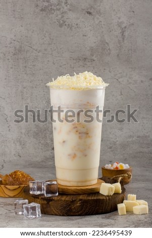 Boba or tapioca pearls is taiwan bubble milk tea in plastic cup with Corn cheese flavor on texture  background, summers refreshment.