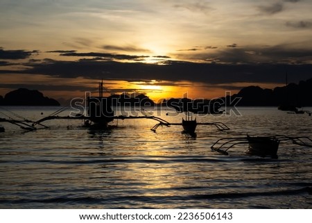 Sunset with boats docking in El Nido, Palawan, Philippines. Royalty-Free Stock Photo #2236506143