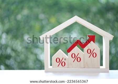Interest rate up and Banking concept, Model house with Percentage symbol icon and red arrow graph on natural green background, Fixed Rate