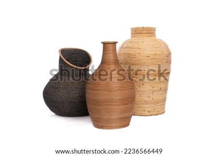 Group of exotic and functional handwoven rattan vase  isolated on white background Royalty-Free Stock Photo #2236566449