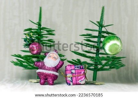 Santa Claus on the background of Christmas trees