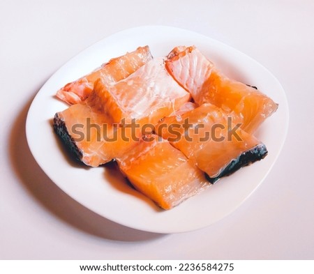 Raw fish pieces fishmeat fishflesh cut sliced piece in a plate rohu machhalee river scalefish flesh closeup image stock photo