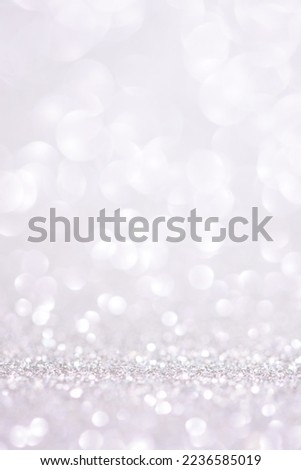 Light glitter vertical background. Christmas wallpaper phone light bokeh sparkle and winter background. Shiny small glitter texture. Copy space. luxury holiday backdrop mockup for display of product