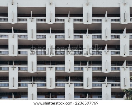 Elements of Soviet modernism. Old buildings from the Soviet era. Balconies and concrete elements. Soviet modernism aesthetic.  Royalty-Free Stock Photo #2236597969