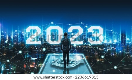 Business technology concept, Professional business man walking on future network Bangkok city background with new year 2023 text and futuristic interface graphic at night in Thailand