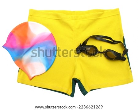 Isolated swimmer’s accessories, includes swimming shorts, multicolor cap, goggles.
 Royalty-Free Stock Photo #2236621269