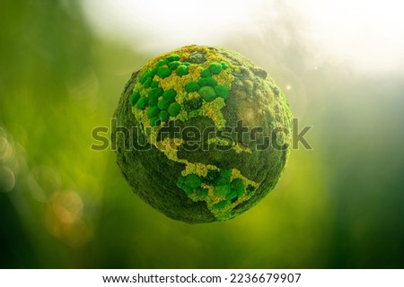 Green planet Earth from natural moss. Symbol of sustainable development and renewable energy Royalty-Free Stock Photo #2236679907