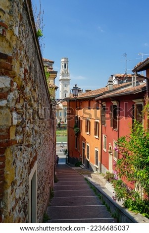Stairways Scalone Castel San Pietro with architecture colourful view. Gas lamp, tower of Verona cathedral and orange and red Mediterranean houses. Royalty-Free Stock Photo #2236685037