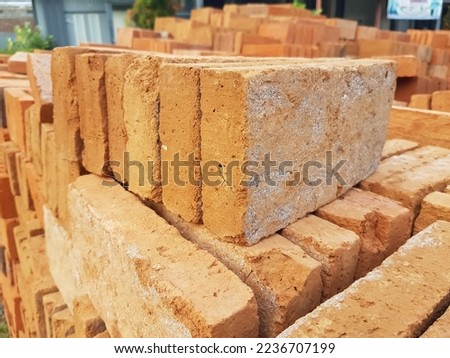 Red brick is a type of basic material for building houses that is very commonly used in Indonesia. Royalty-Free Stock Photo #2236707199
