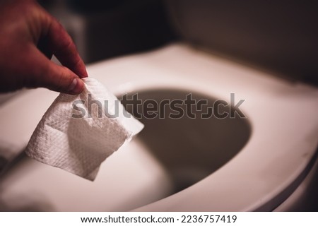 Disposable wipes being flushed down a toilet where they can cause clogging and problems with wastewater treatment.