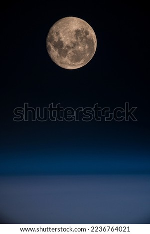 View of a full moon over the Pacific Ocean from the international space station. Digitally enhanced. Elements of this image furnished by NASA.