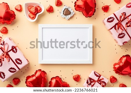 Valentine's Day concept. Top view photo of photo frame present boxes heart shaped balloons saucer with chocolate candies and sequins on isolated pastel beige background with copyspace