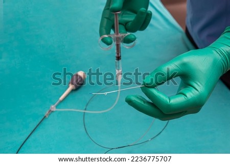 Optical coherence tomography (OCT). Purge catheter with contrast. Intravenous Administration of Contrast Agents for Enhanced CT or MR Scans. Heart catheterization instrument for heart surgery. Royalty-Free Stock Photo #2236775707