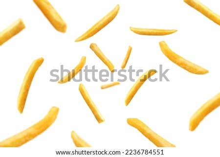 Falling french fries, potato fry isolated on white background, selective focus Royalty-Free Stock Photo #2236784551