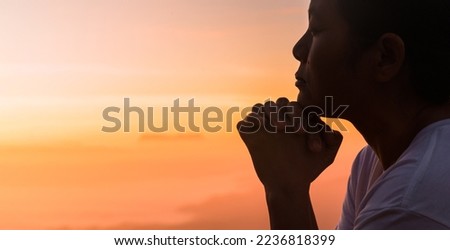 Silhouette of woman hand praying spirituality and religion, female worship to god. Christianity religion concept. Religious people are humble to God. Christians have hope faith and faith in god. Royalty-Free Stock Photo #2236818399