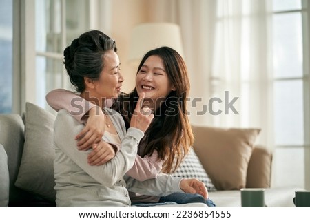 happy senior asian mother and adult daughter having a good time at home Royalty-Free Stock Photo #2236854555