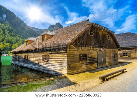 Wooden old houses on the lake in Schoenau am Koenigssee, Konigsee, Berchtesgaden National Park, Bavaria, Germany. Royalty-Free Stock Photo #2236863925