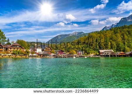 Wooden old houses on the lake in Schoenau am Koenigssee, Konigsee, Berchtesgaden National Park, Bavaria, Germany. Royalty-Free Stock Photo #2236864499