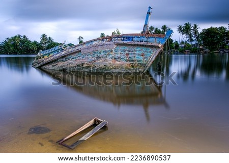 Abandoned boat in nature background. Long exposure may cause motion blur. Fine art photography