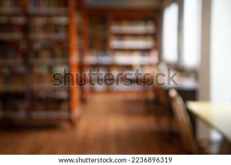 Abstract blurred public library interior space. blurry room with bookshelves by defocused effect. use for background or backdrop in business or education concepts Royalty-Free Stock Photo #2236896319