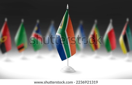 The national flag of the South Africa on the background of flags of other countries