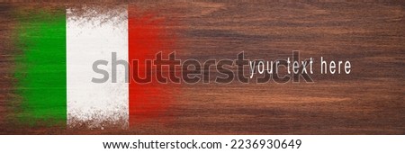 Flag of Italy. Flag is painted on a wooden surface. Wooden background. Plywood surface. Copy space. Textured creative background