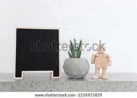 image of empty chalkboard over wooden table. Copy space for mock up and menu