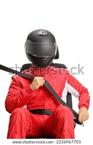 Car driver with a helmet fastening a seatbelt isolated on white background Royalty-Free Stock Photo #2236967703