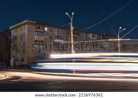 Night cityscape of a big city under the starry sky. Blackout to the Dnieper. Ukraine. Beautiful starry sky over the city of Dnipro. Night city lights. background image