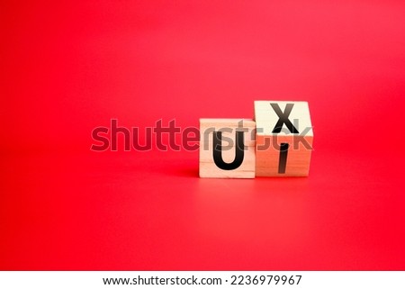 wooden cube with UX and UI or User Interface and User Experience design