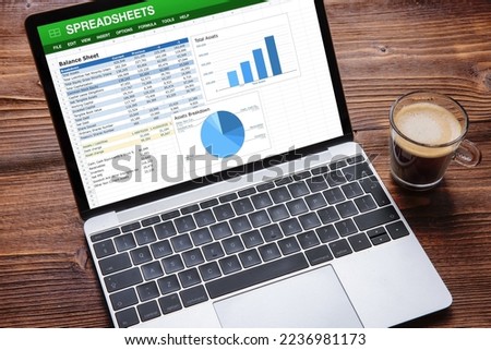 Laptop computer with sample spreadsheets document on the screen Royalty-Free Stock Photo #2236981173