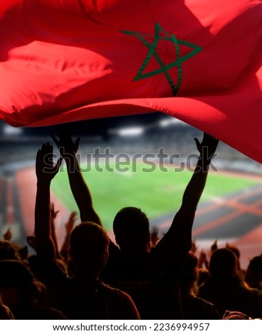 soccer supporters and Morocco flag