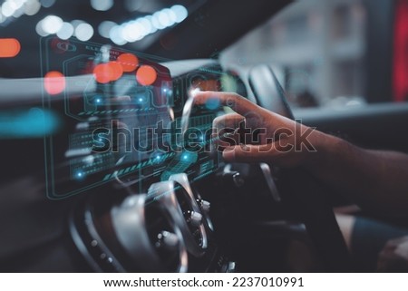 graphic user interface and a futuristic car (GUI). intelligent vehicle connected vehicle The Internet of Things the head-up display (HUD) Royalty-Free Stock Photo #2237010991