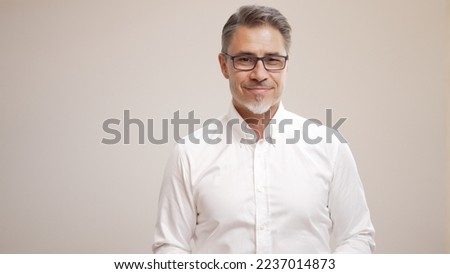 Middle age businessman in white business shirt. Casual entrepreneur. Portrait of mid adult, mature age man, happy smiling. Isolated on white, copy space.