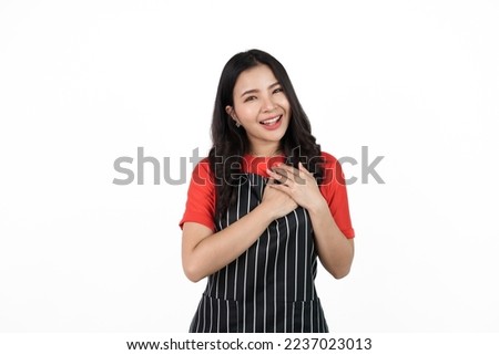 Love yourself, impressive, Food shop owner concept, Smiling young confident asian woman in black apron and red t-shirt isolated on white background.