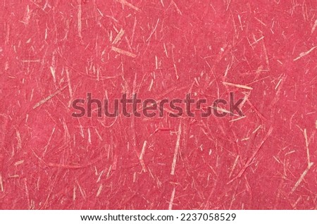 Red mulberry paper texture used for a background.